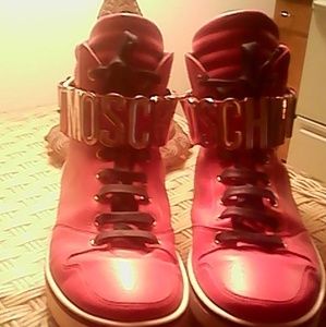 Moschino Red hightops with gold buckle